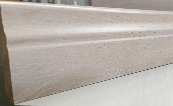 A close up of a piece of wood on a table.