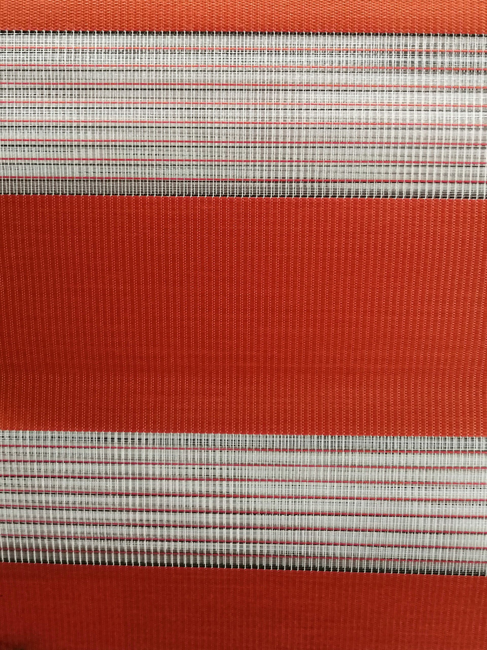 A close up of a red and white striped fabric.