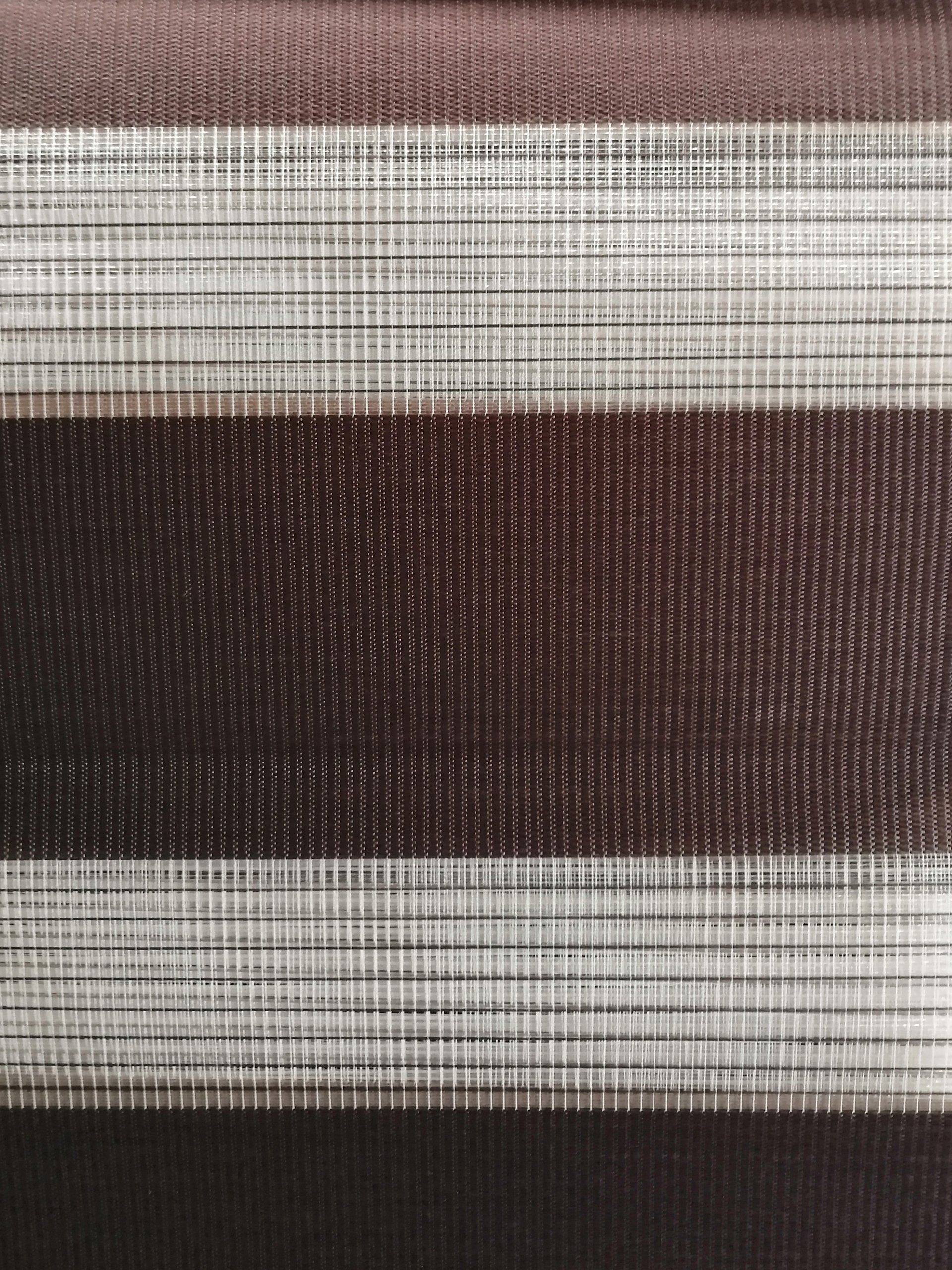 A close up of a brown and white striped fabric.