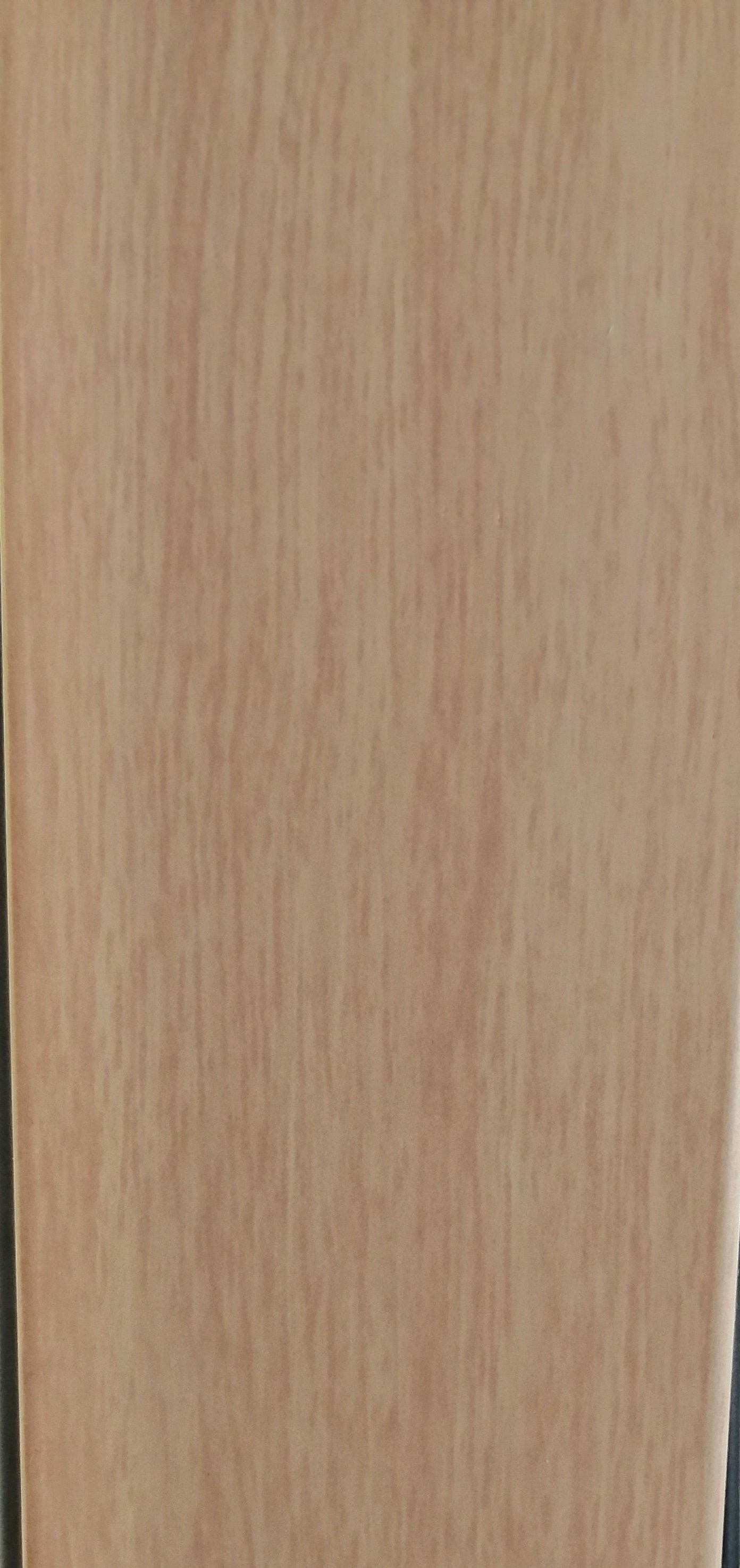 A close up of a piece of wood with a grainy texture.