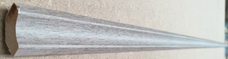 A paper cone is sitting on a wooden table.