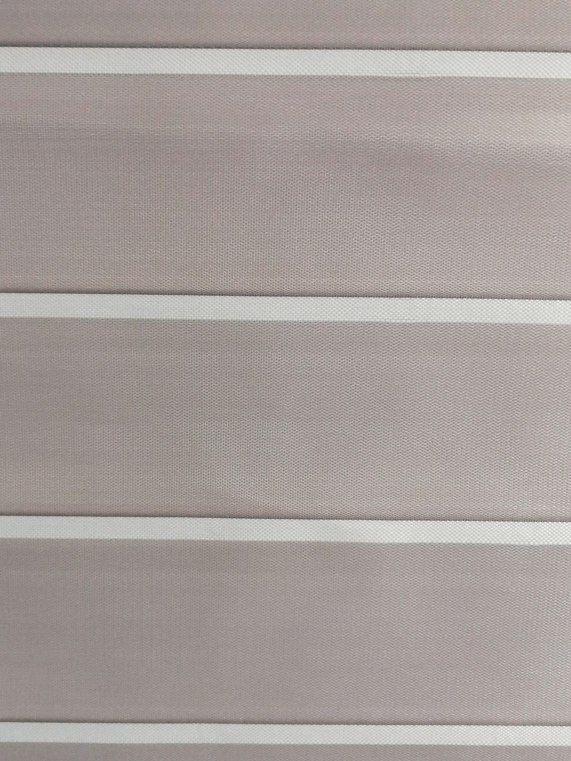 A close up of a striped fabric with white stripes.
