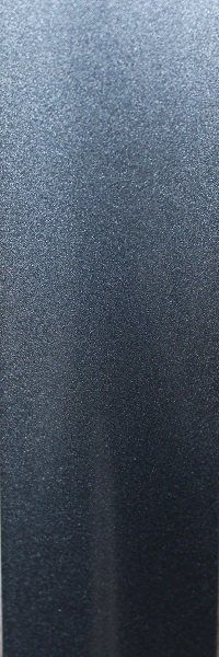 A close up of a stainless steel surface with a grainy texture.