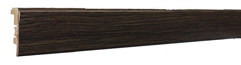 A close up of a wooden skirting board on a white background.