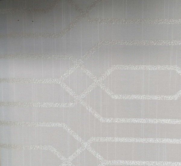 A close up of a white fabric with a geometric pattern on it.