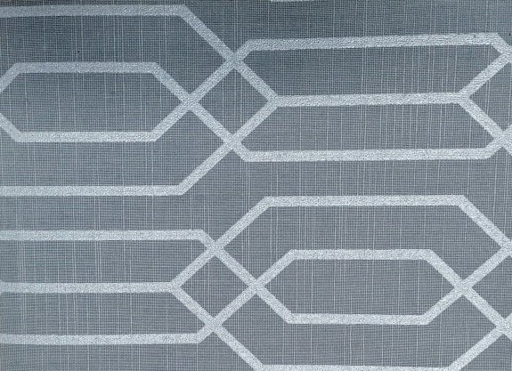 A close up of a gray rug with a white pattern on it.