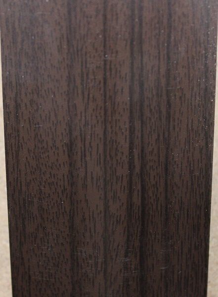 A close up of a piece of wood on a table.