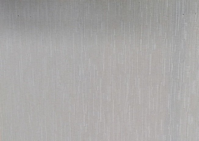 A close up of a white fabric texture.