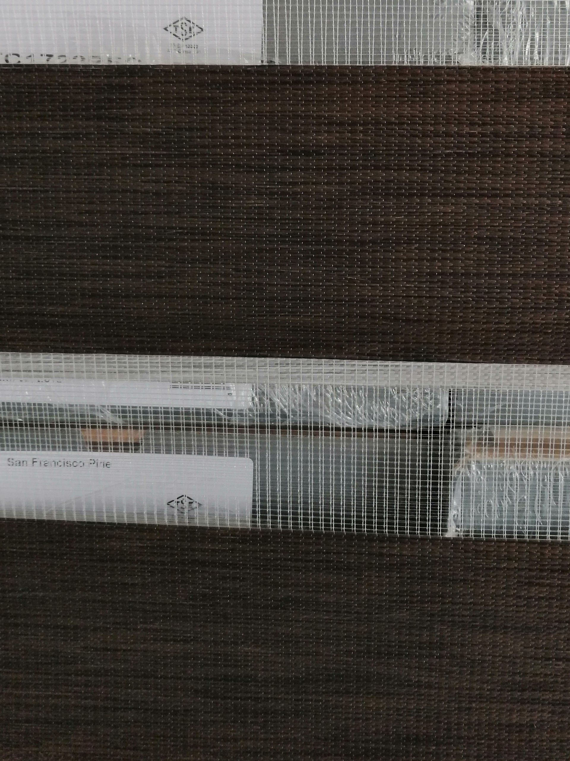 A close up of a piece of fabric with a striped pattern.