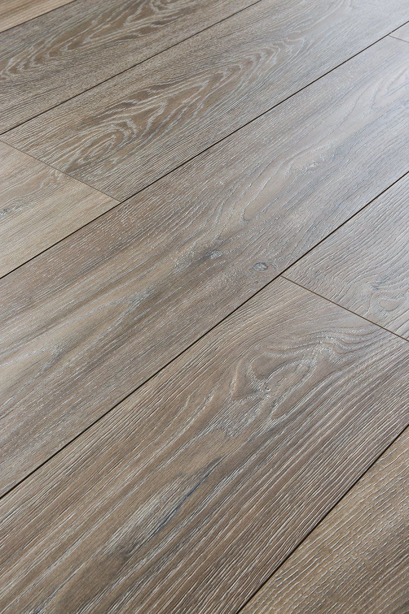 A close up of a wooden floor in a room.