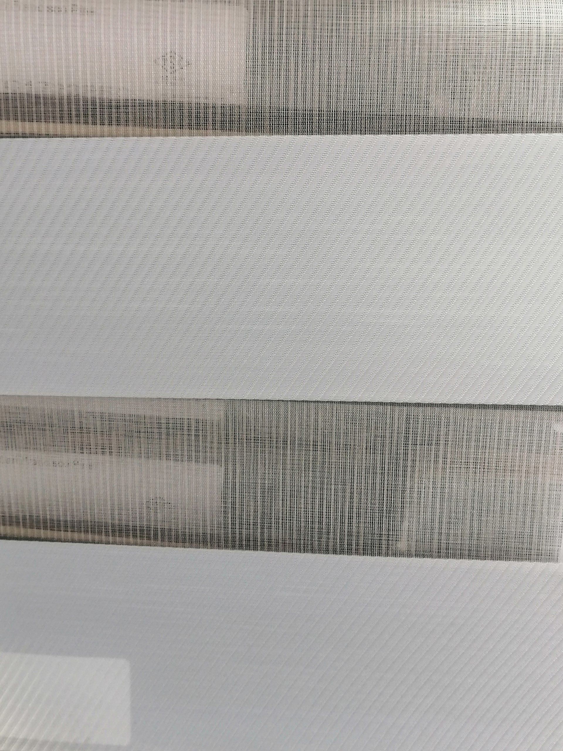 A close up of a piece of wood on a white surface.