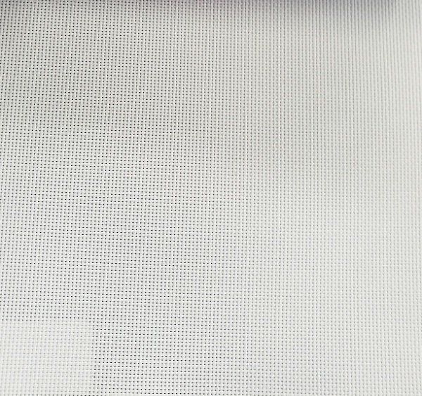 A close up of a white fabric with a grid pattern.