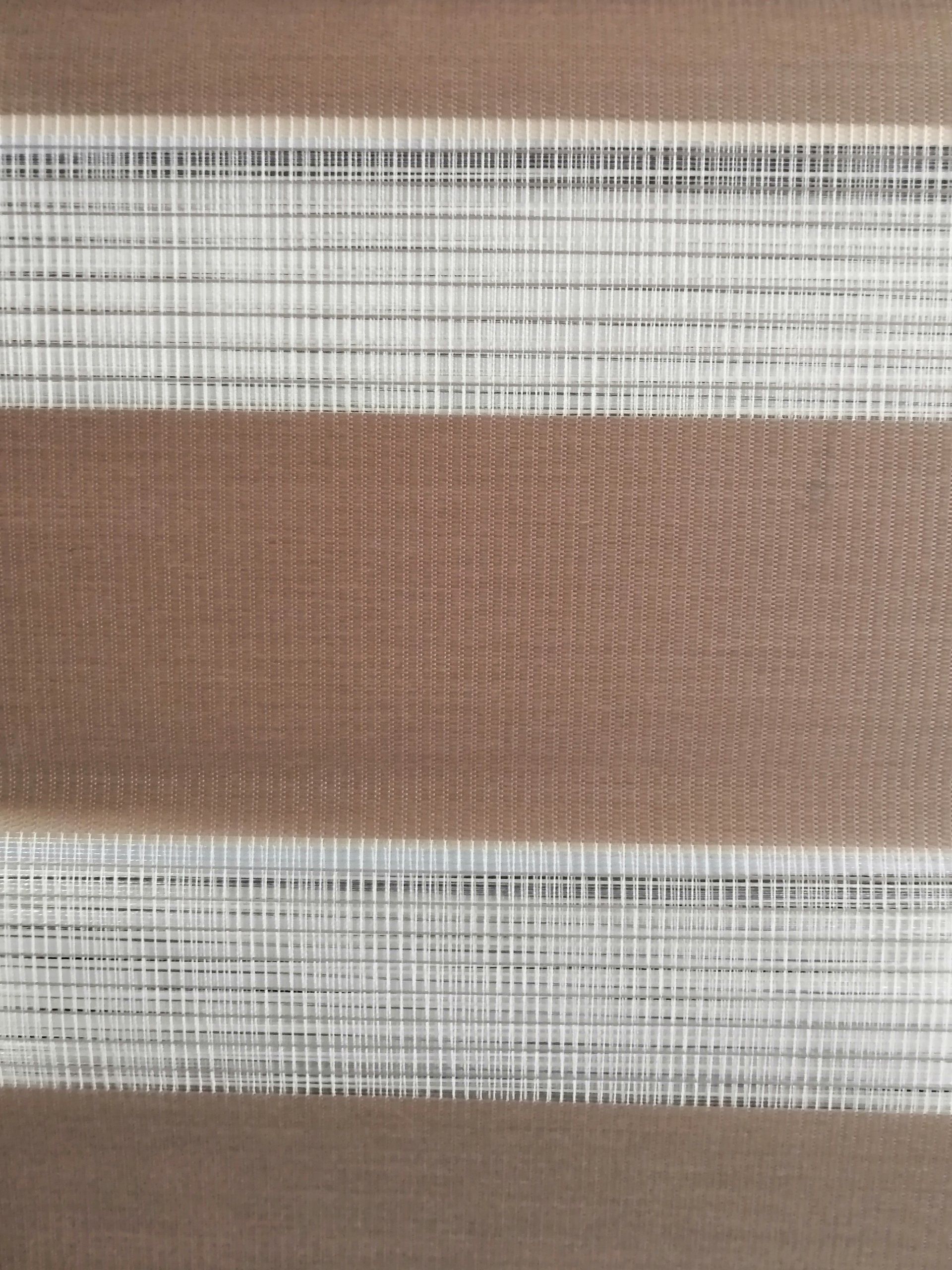 A close up of a brown and white striped fabric.