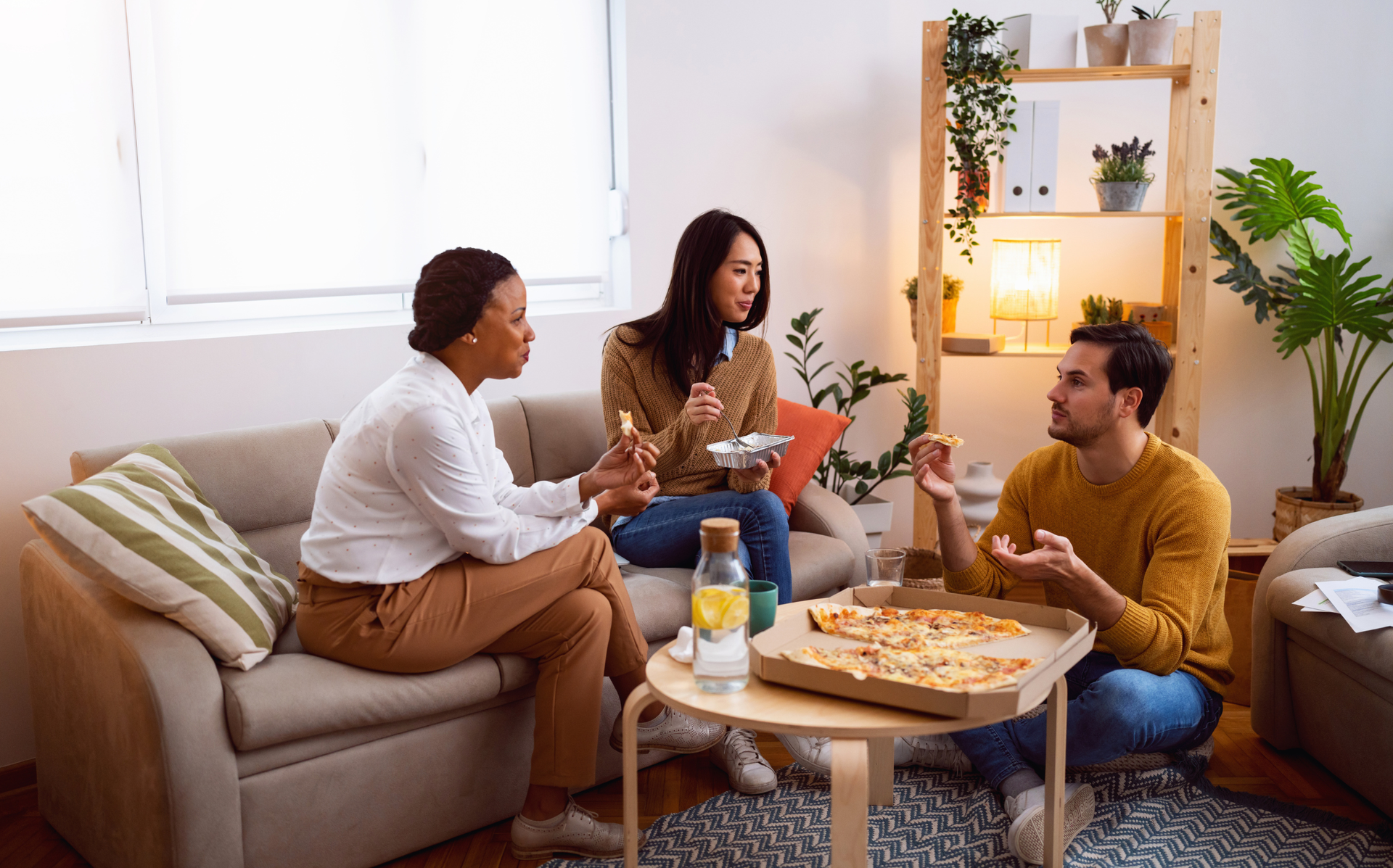 People interacting in a shared housing environment that highlights co-living and modern community living.