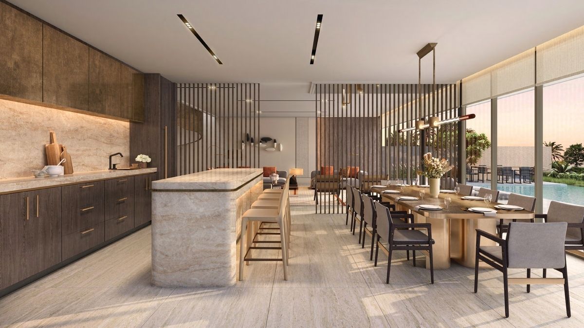 Modern open-plan kitchen and dining area with island, wood cabinets, dining table, and large windows overlooking a pool.