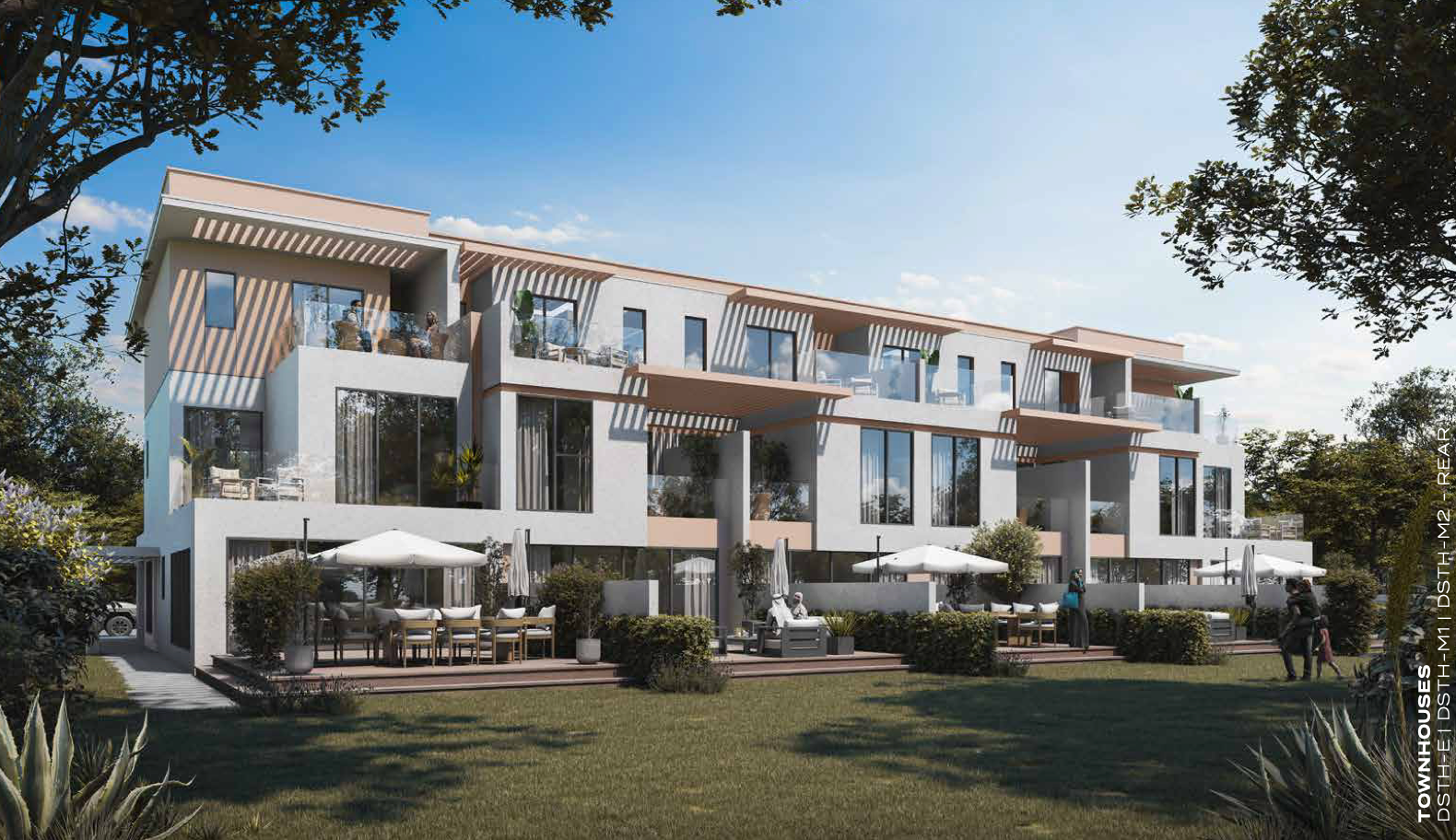 Row of modern townhouses with outdoor patios and landscaping under a sunny sky.