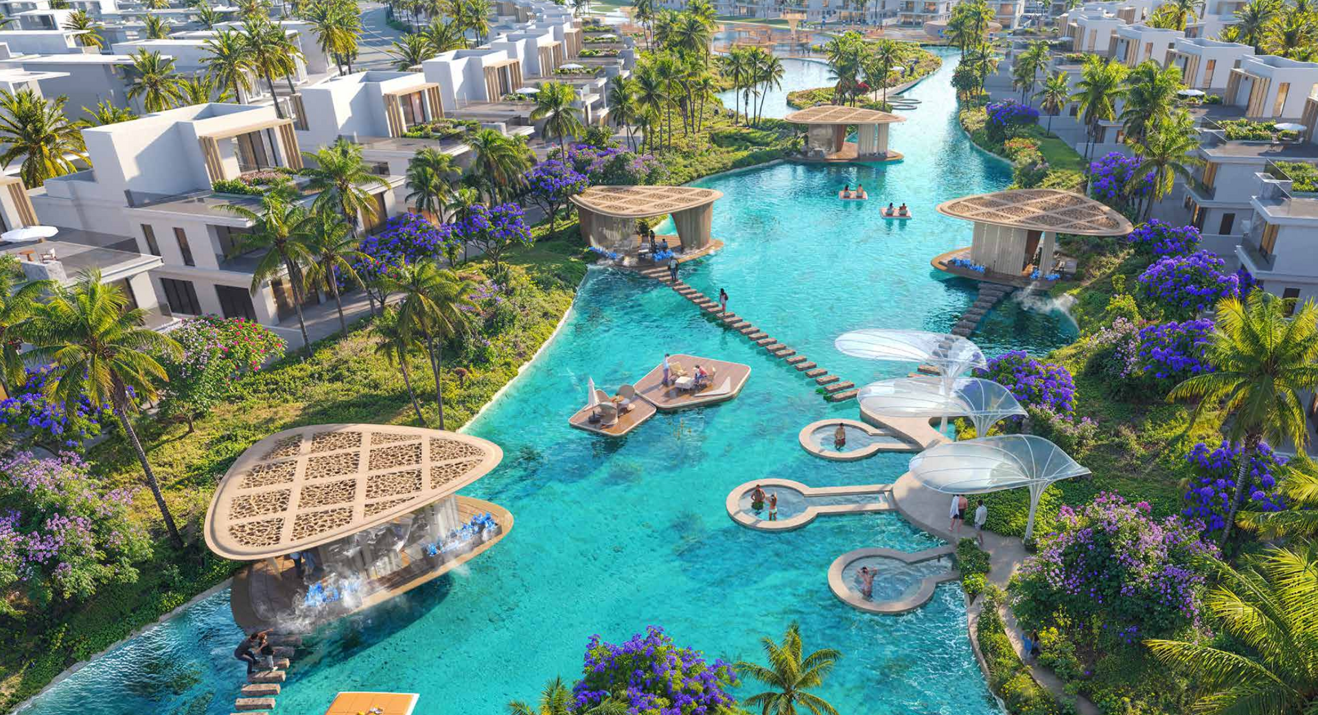 A turquoise water canal winds through a resort, with bridges, huts, and people swimming.