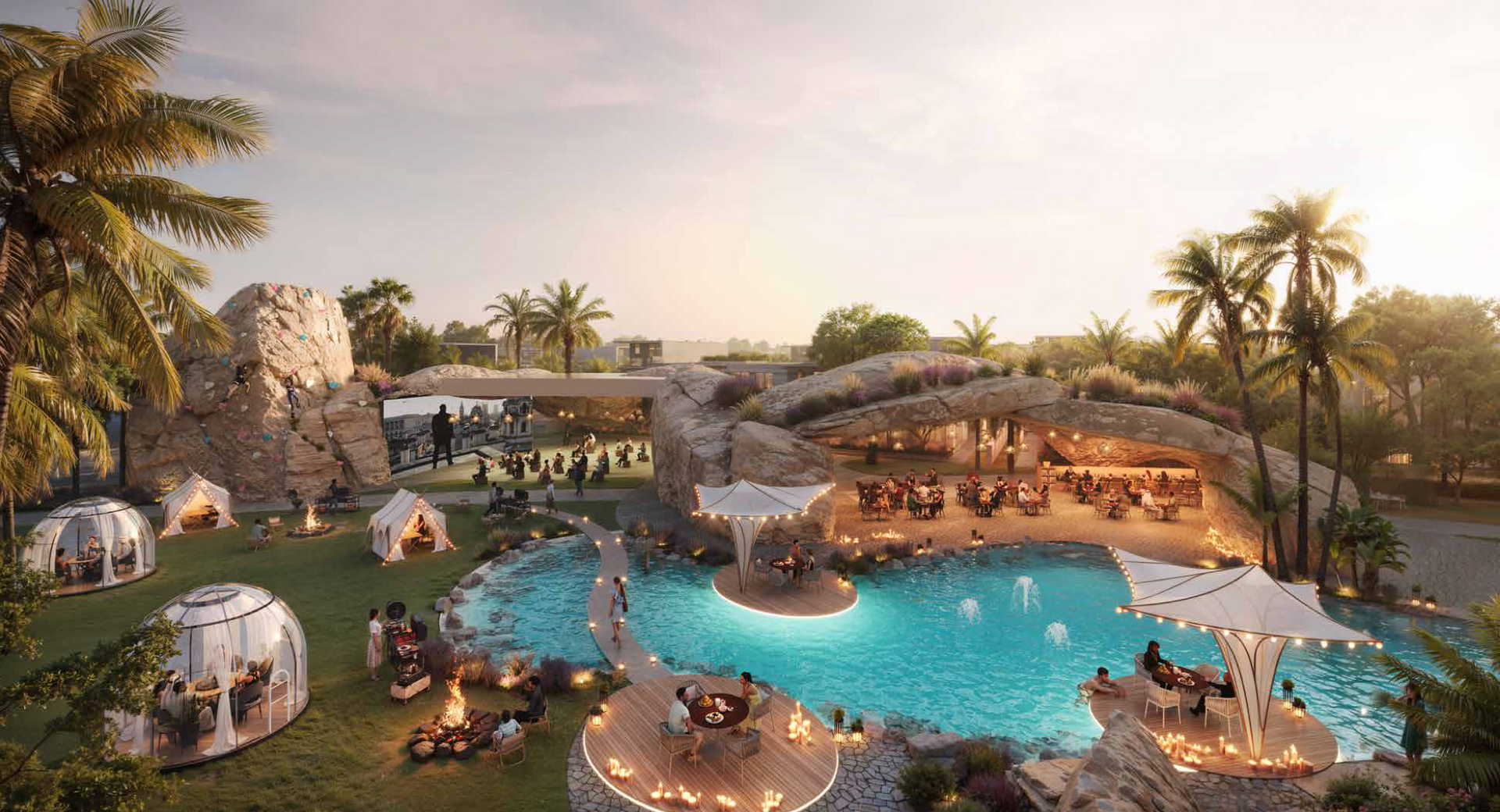 Resort with pool, dining, and igloo-style accommodations, under a sunset sky with palm trees.