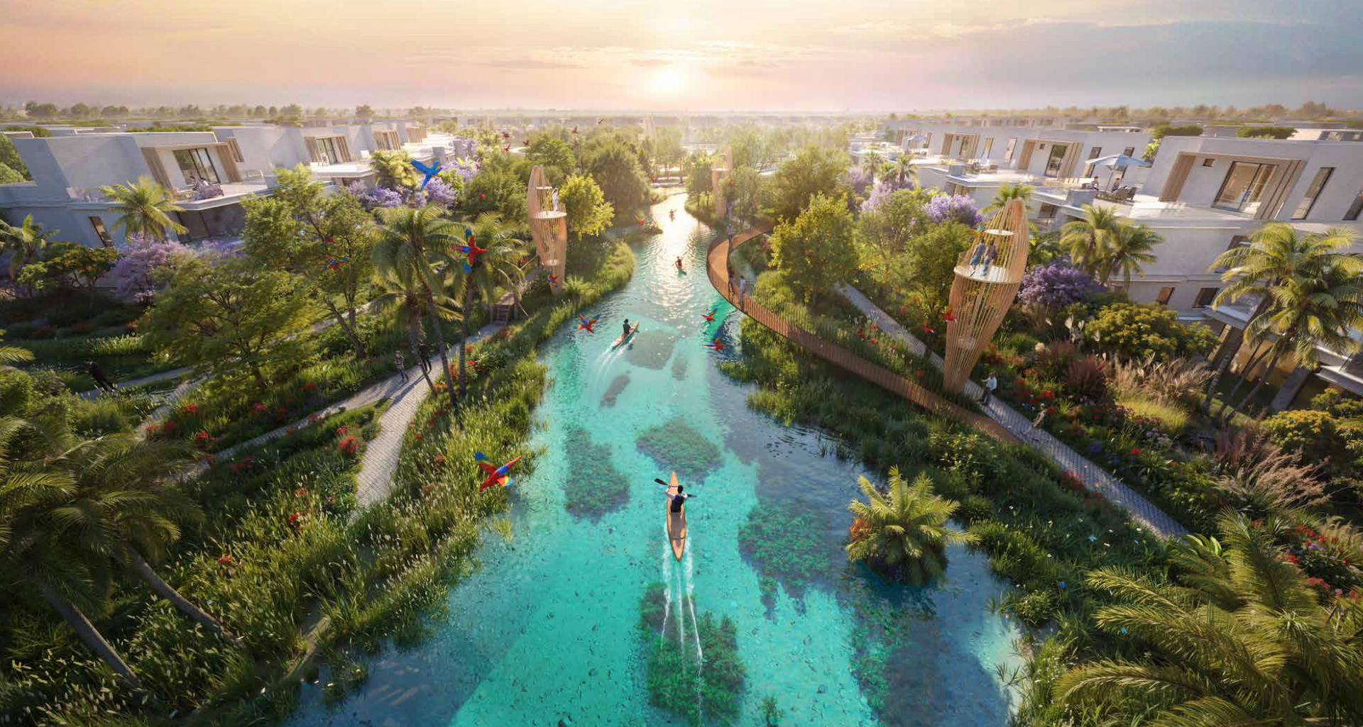 Aerial view of turquoise river with people paddleboarding, flanked by lush green trees, homes, and decorative towers.