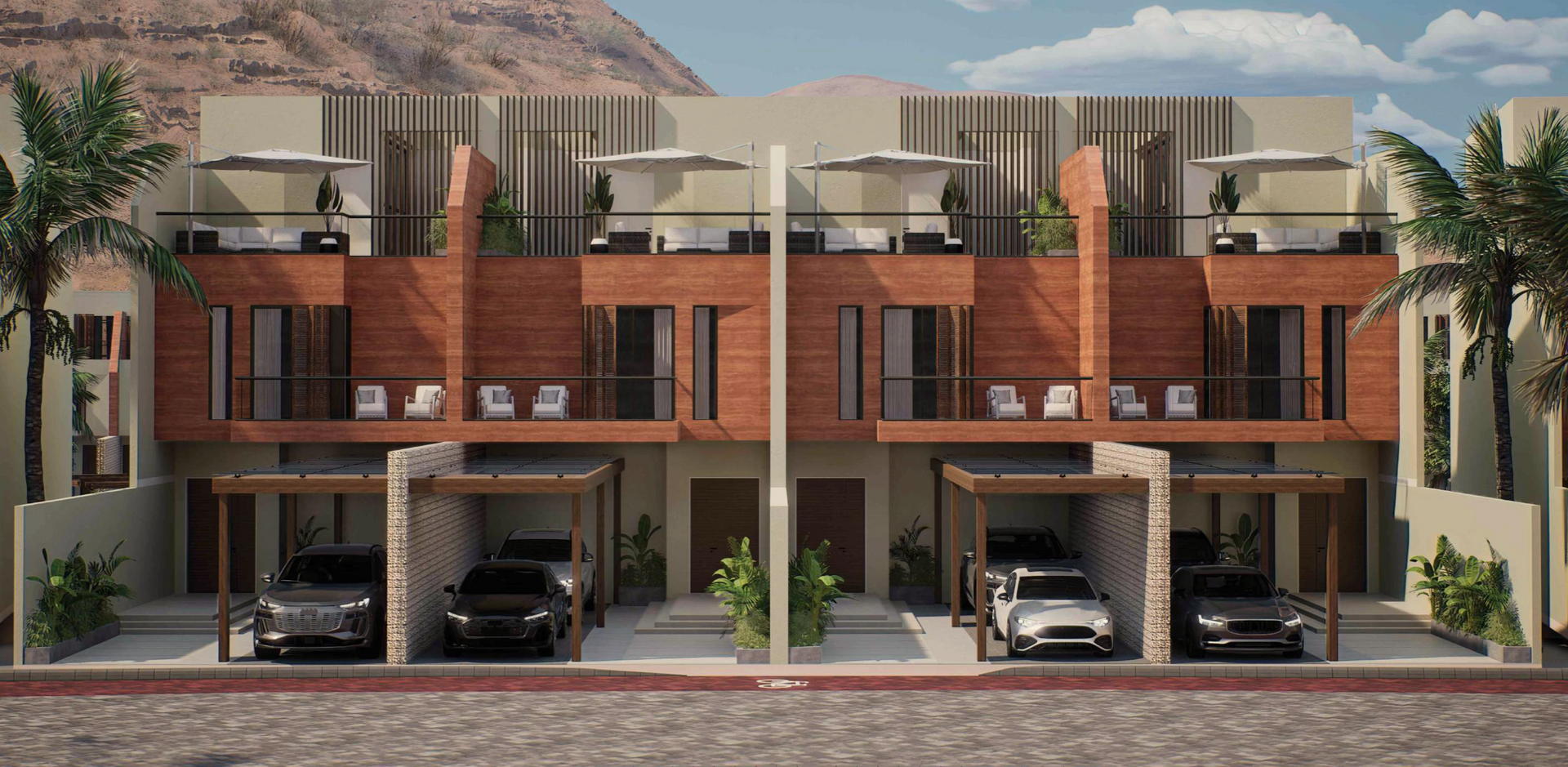 Townhouses with brick facade, carports, and cars parked in front. Palm trees and mountain background.