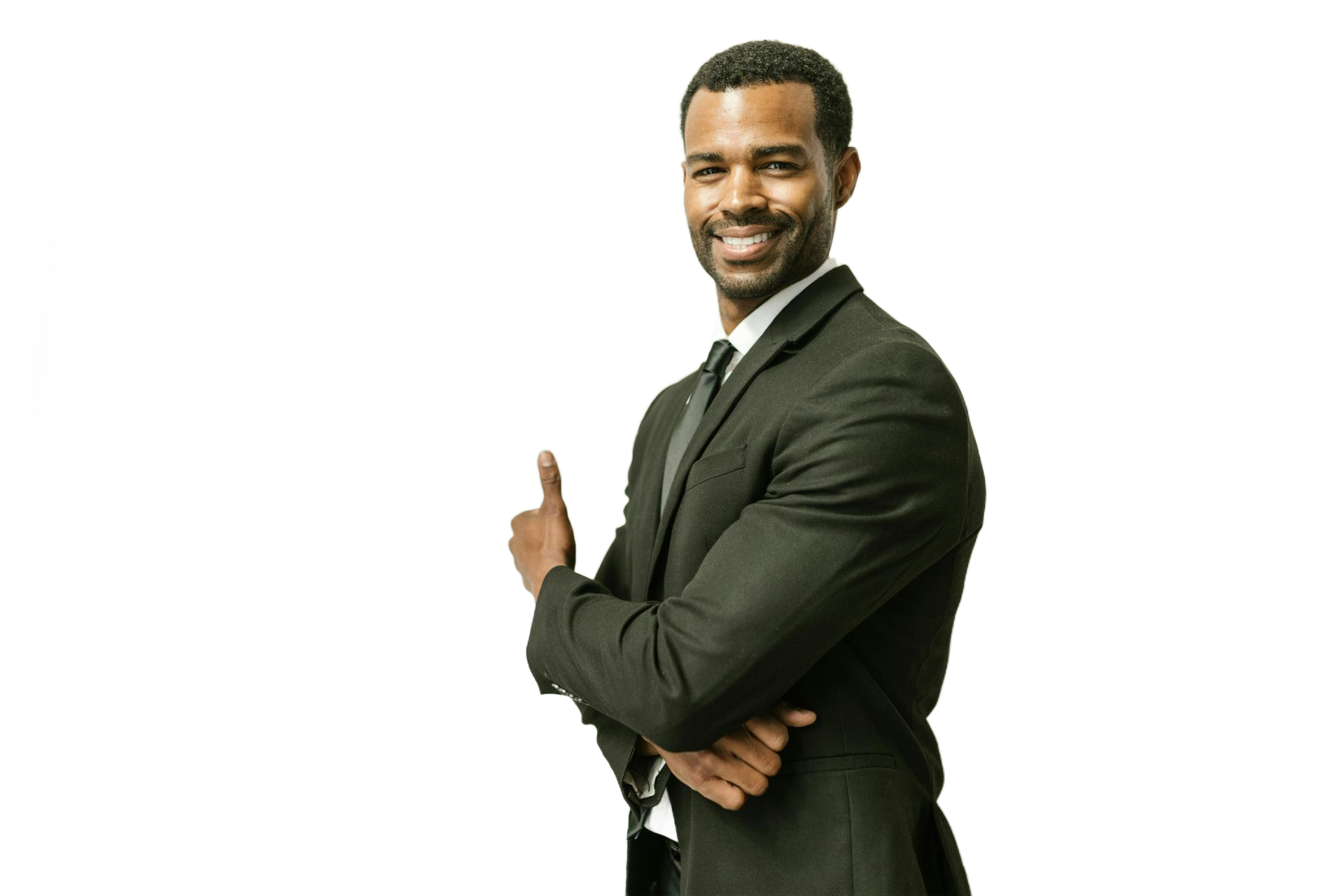 Man in suit smiling, giving a thumbs-up.