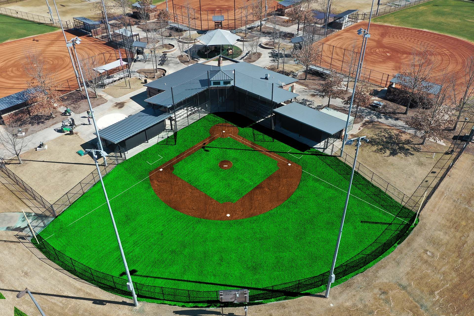 an aerial view of a baseball field with artificial turf and dirt