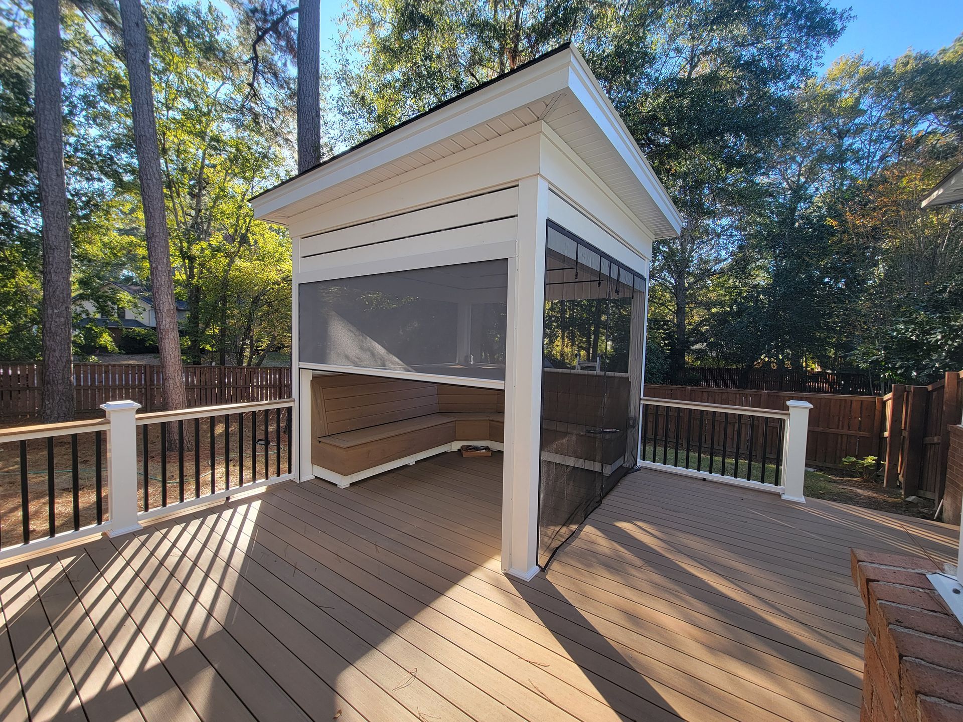 There is a gazebo on the deck with a screened in area.