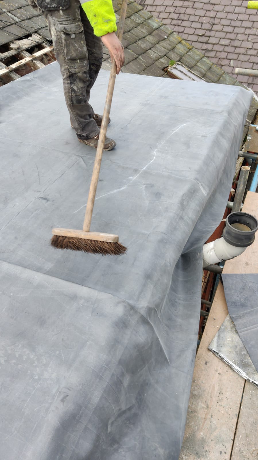 Roofers Kilmarnock flattening out a section of flat roofing