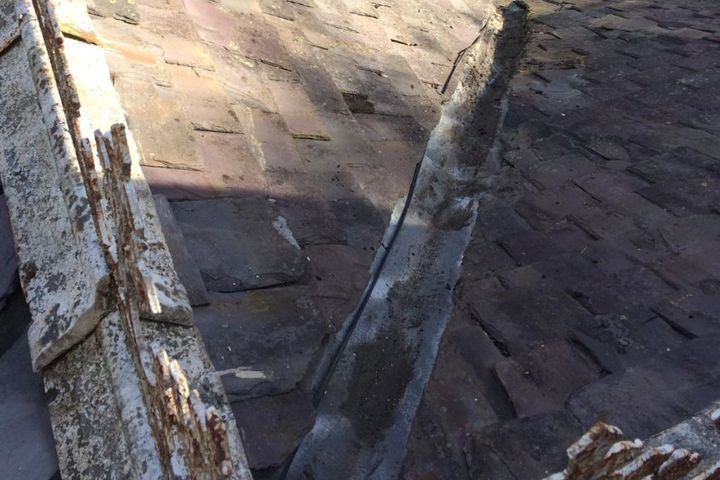 Roofers Kilmarnock roof tiles reattached to roof and gutter clear