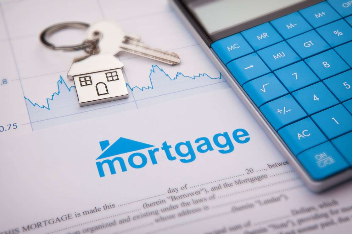 Mortgage papers and calculator