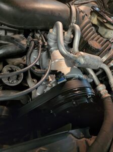 Up close to AC Compressor in vehicle | Tedious Auto Repair