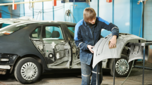 Technician preparing part for replacement on vehicle | Tedious Auto Repair