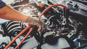 Technician working on electrical system under hood | Tedious Auto Repair