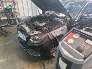 Vehicle in our garage with hood up, repair in progress | Tedious Auto Repair
