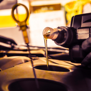 Oil being poured into vehicle | Tedious Auto Repair