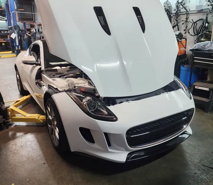 White modern car with hood up | Tedious Auto Repair