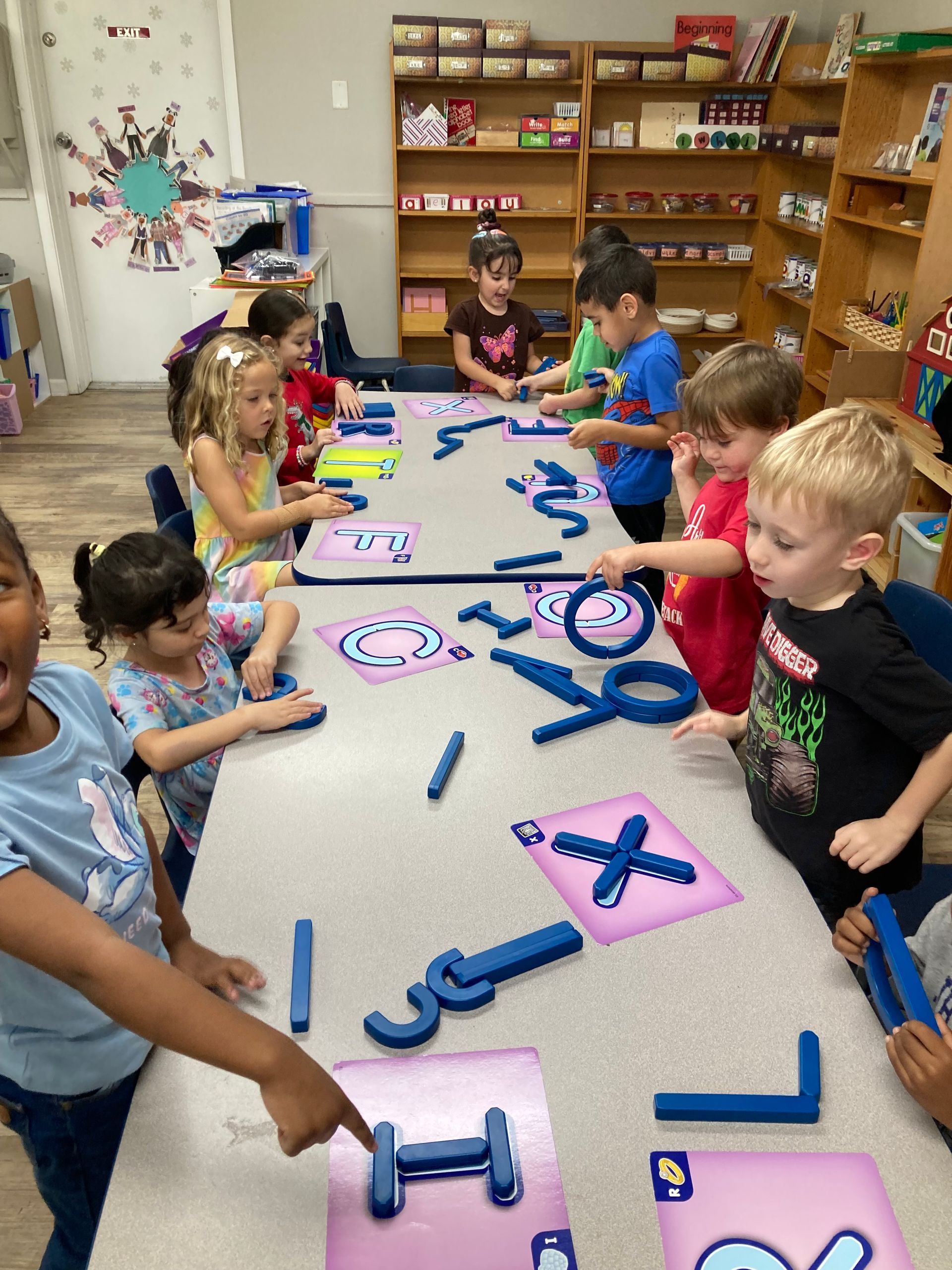 Group of Children Are Sitting on the Floor Playing Musical Instruments