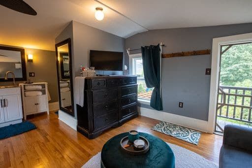 A living room filled with furniture and a television.