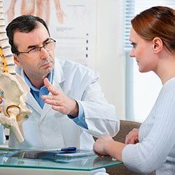 Doctor with patient — back pain in Stillwater,OK