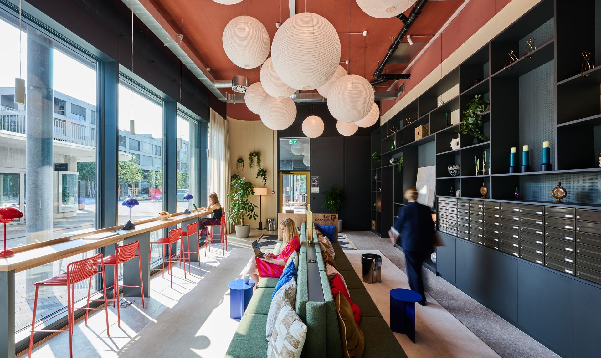 A large room with a lot of windows and a couch.