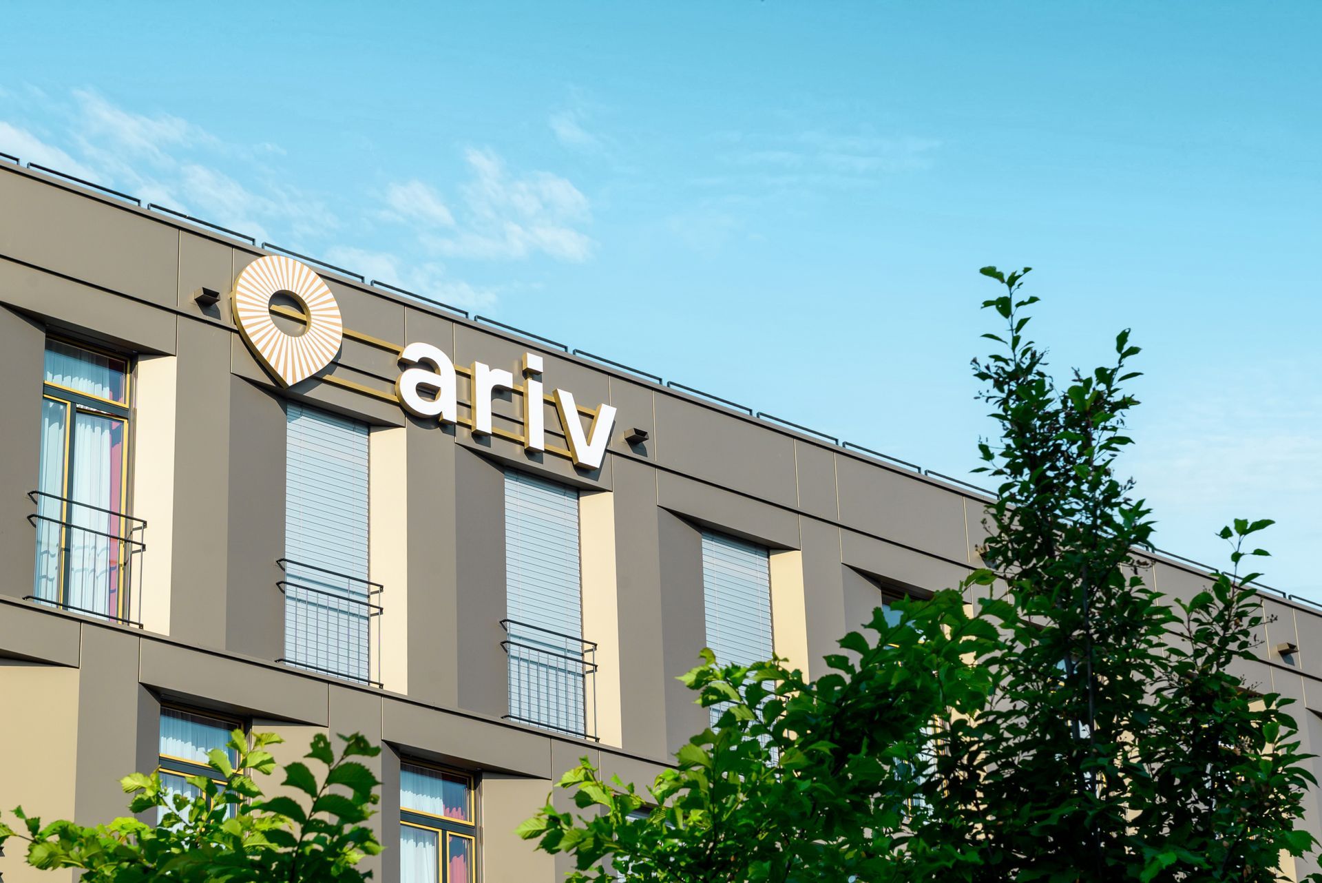 A large building with the word ariv on it