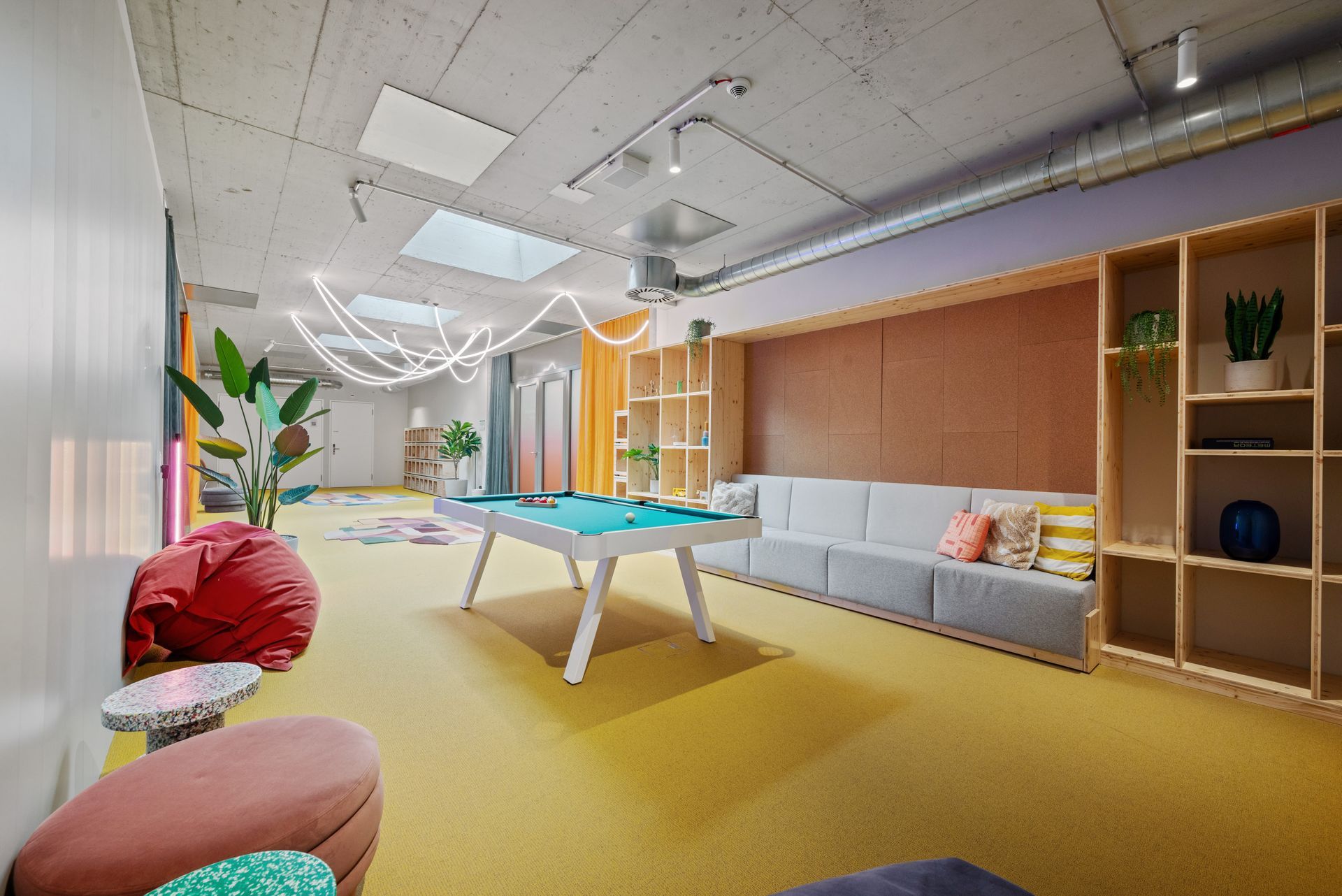 There is a pool table in the middle of the room.