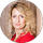 A woman in a red shirt is standing in a circle.