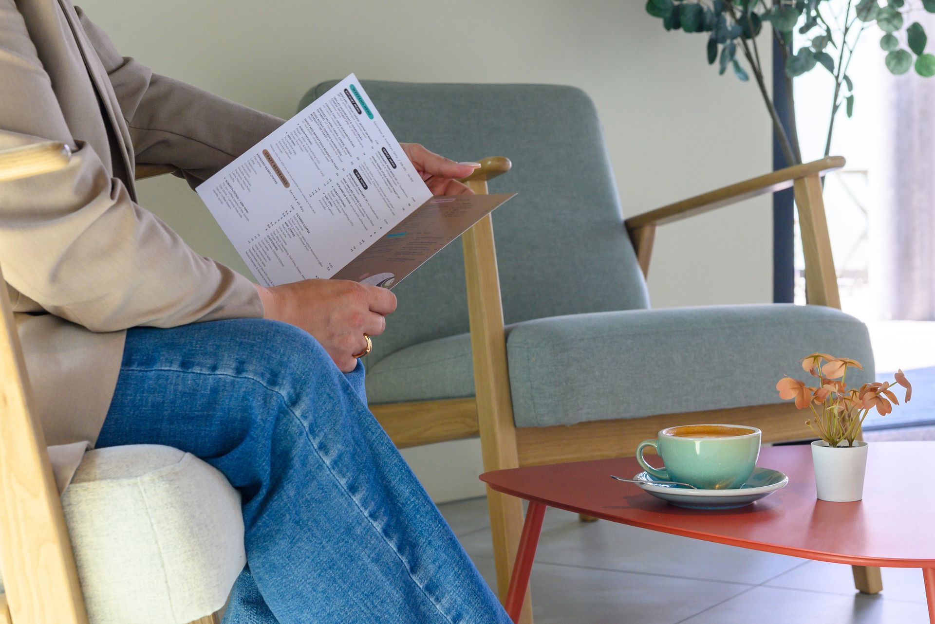 A person is sitting in a chair holding a clipboard.