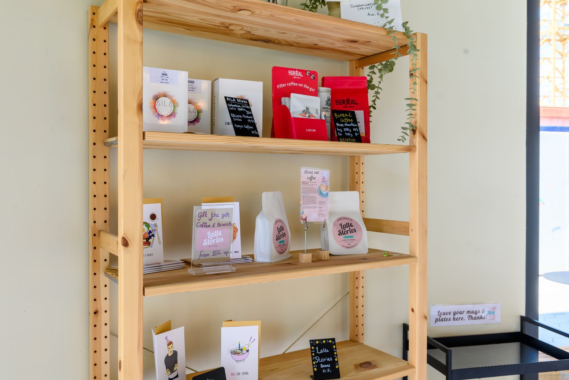 A wooden shelf with a variety of items on it.