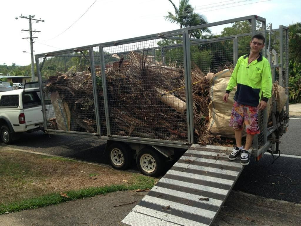Man Standing Next to Trailer Loaded — All Suburbs Garden Bags in Kuranda, QLD
