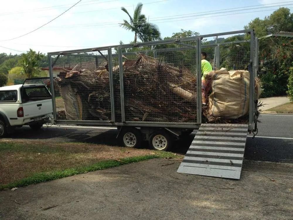 Trailer Loaded With Yard Waste, Ramp Deployed — All Suburbs Garden Bags in Holloways Beach, QLD