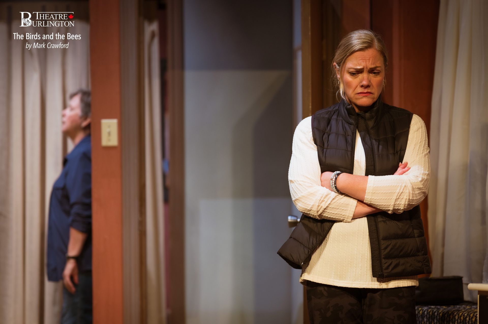 Woman wrapped in pink blanket, looks scared. Man shirtless, pulling the blanket, looks shocked.