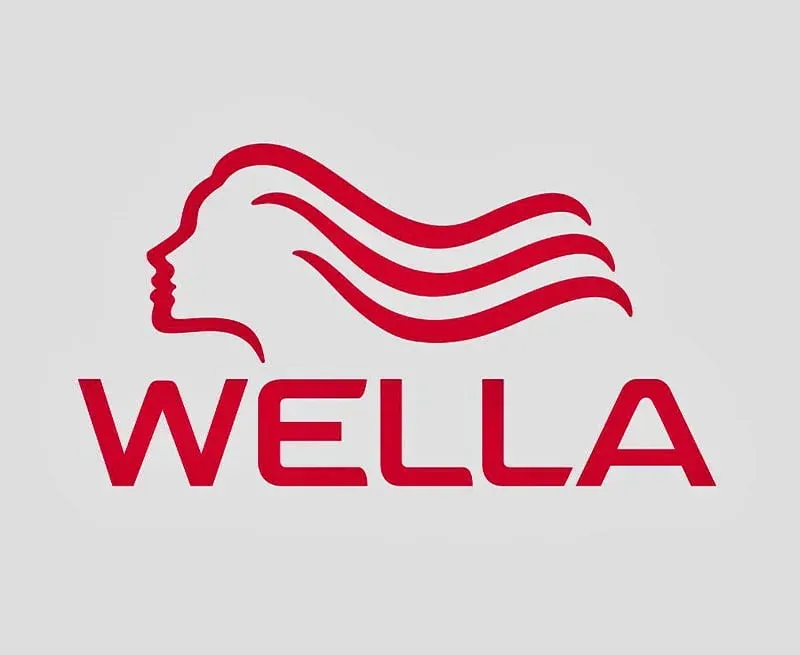Wella logo: Red silhouette of a woman's head and flowing hair above the word