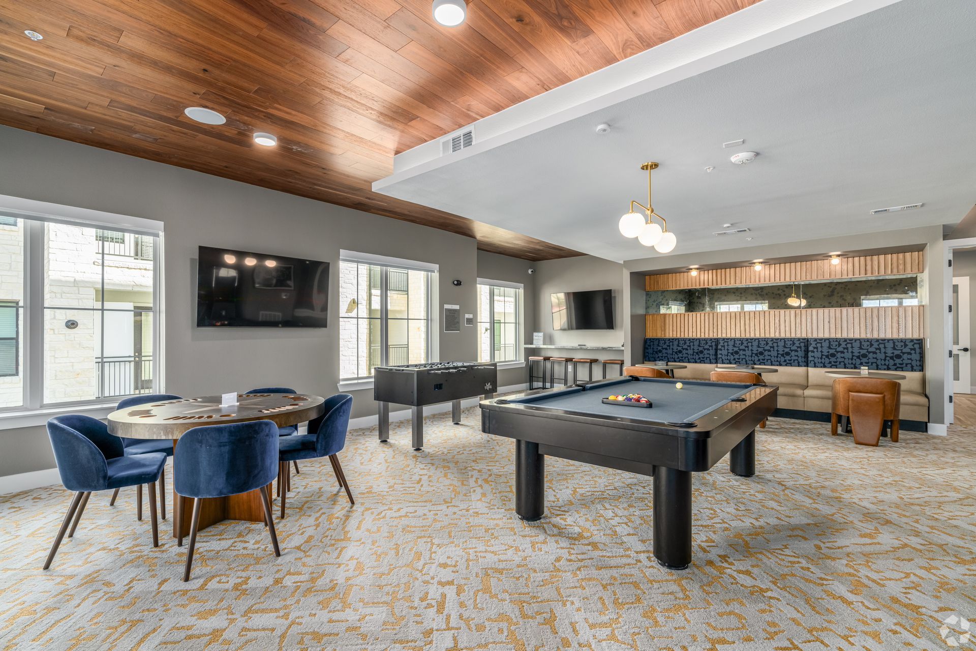 There is a pool table in the middle of the clubroom at The Wyatt, offers luxury apartments in North Austin, TX.